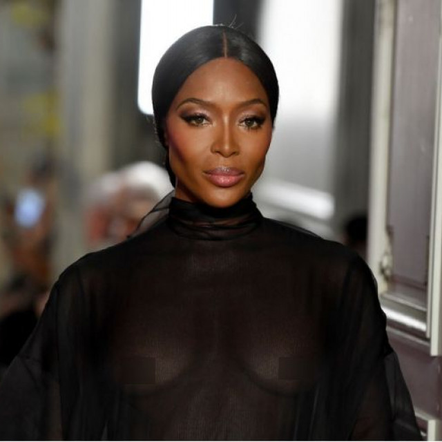 48-year-old Naomi Campbell showed her bare breasts on the podium